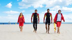 RNLI lifeguards in North Norfolk walk along the beach