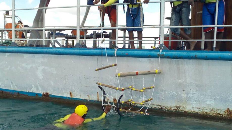 Tanzania Sea Rescue testing a casualty recovery device on the side of a boat at sea